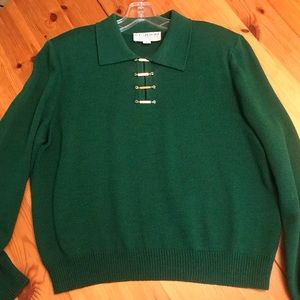 Green sweater with gold buckles